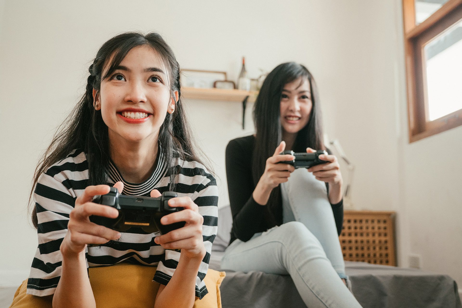 Two girls playing video games